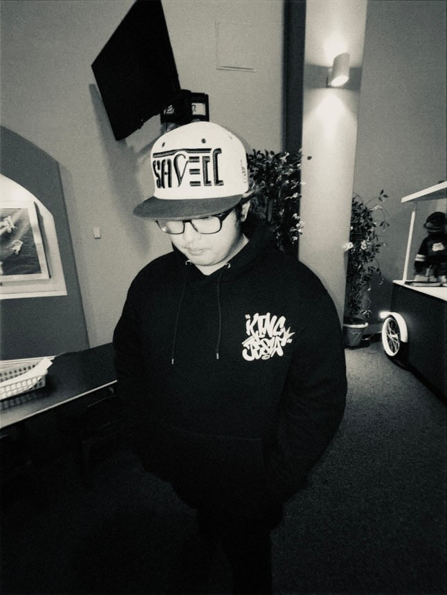 Black and white photo of a model wearing the King Jesus Hoodie, a bold Christian streetwear design featuring faith-inspired urban fashion.